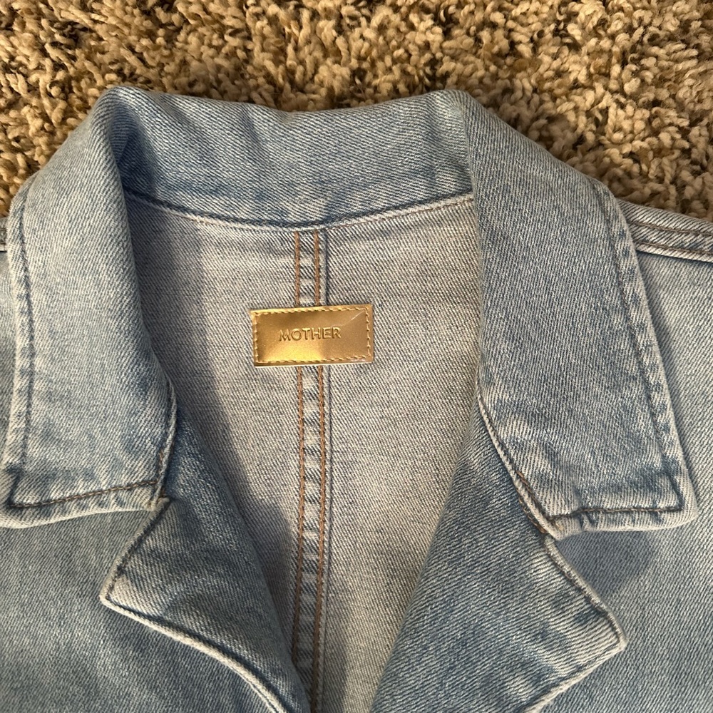 Beautiful jean jumpsuit only wore two times. Can dress up or down!